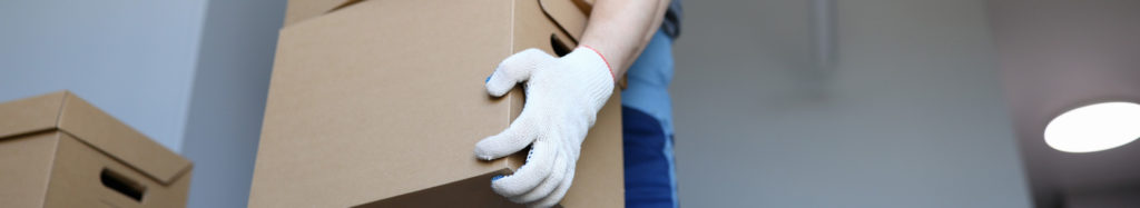 Careful Movers relocation crew loading furniture into a branded removal truck